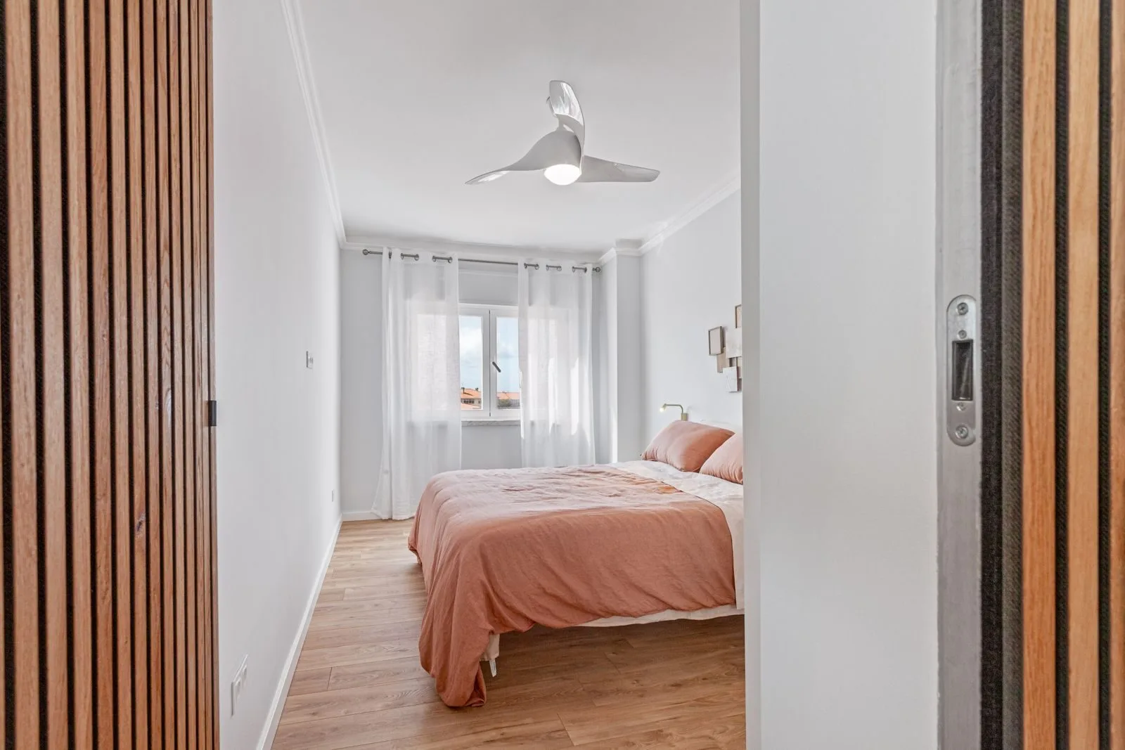 Master bedroom through wood slats — Alvide renovation by Maya's Homes