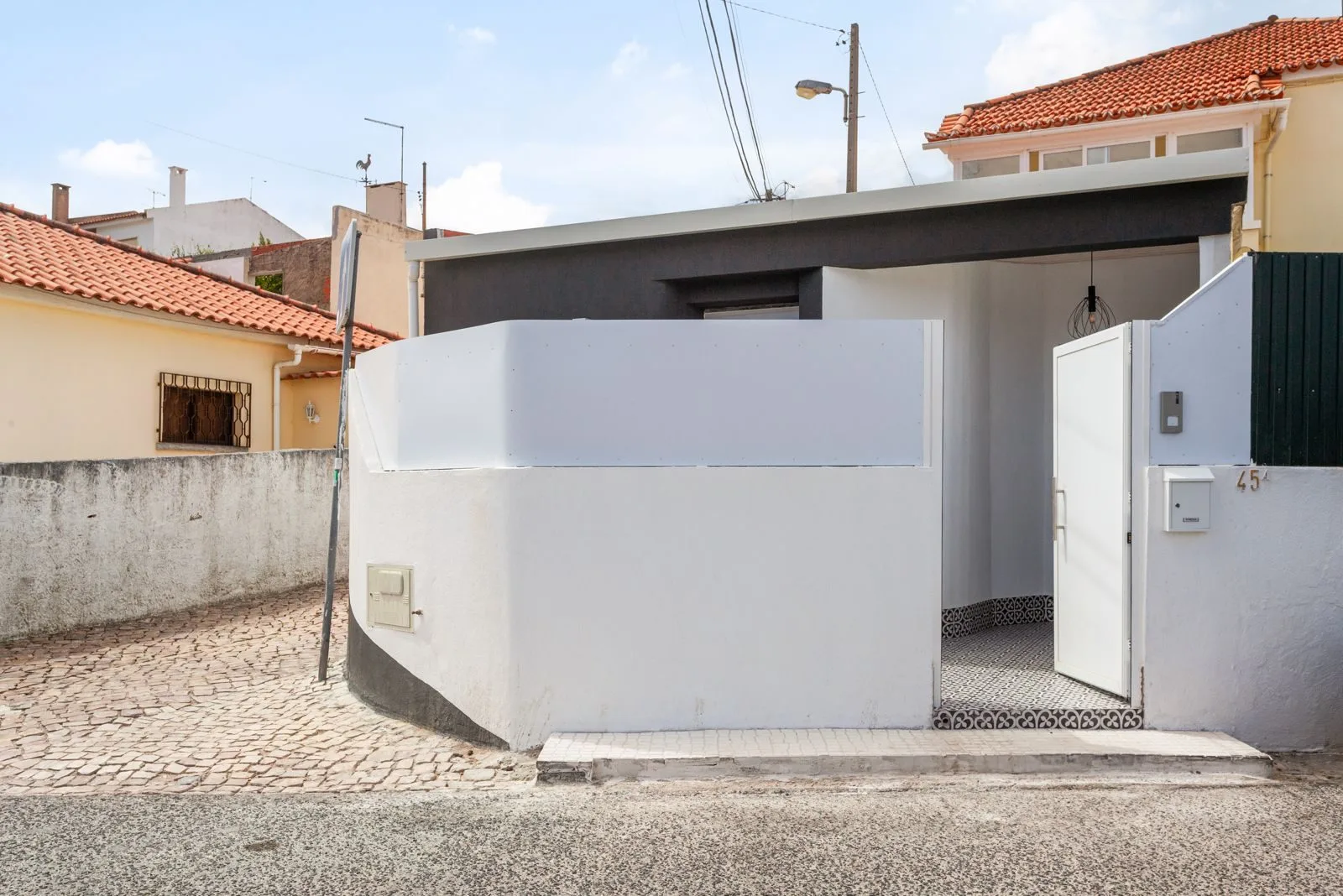 After — renovated loft exterior with new facade — Amoreira conversion Cascais by Maya's Homes