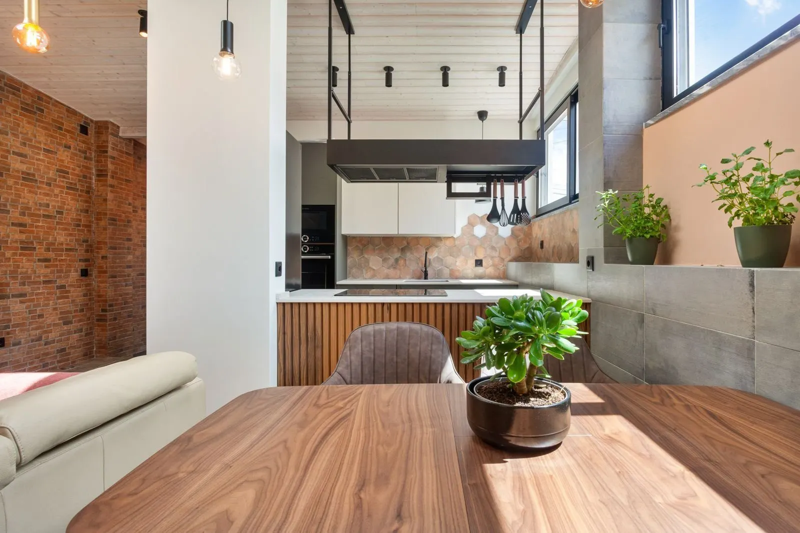 Dining area under wood-panelled ceiling — Amoreira loft Cascais by Maya's Homes