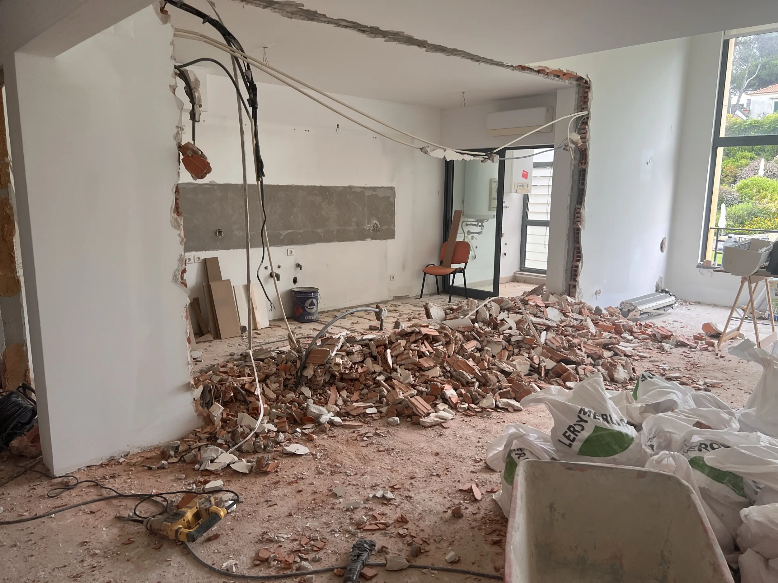 Belle Rivi&egrave;re mid-renovation &mdash; the kitchen wall coming down to make it open-plan, rubble across the floor