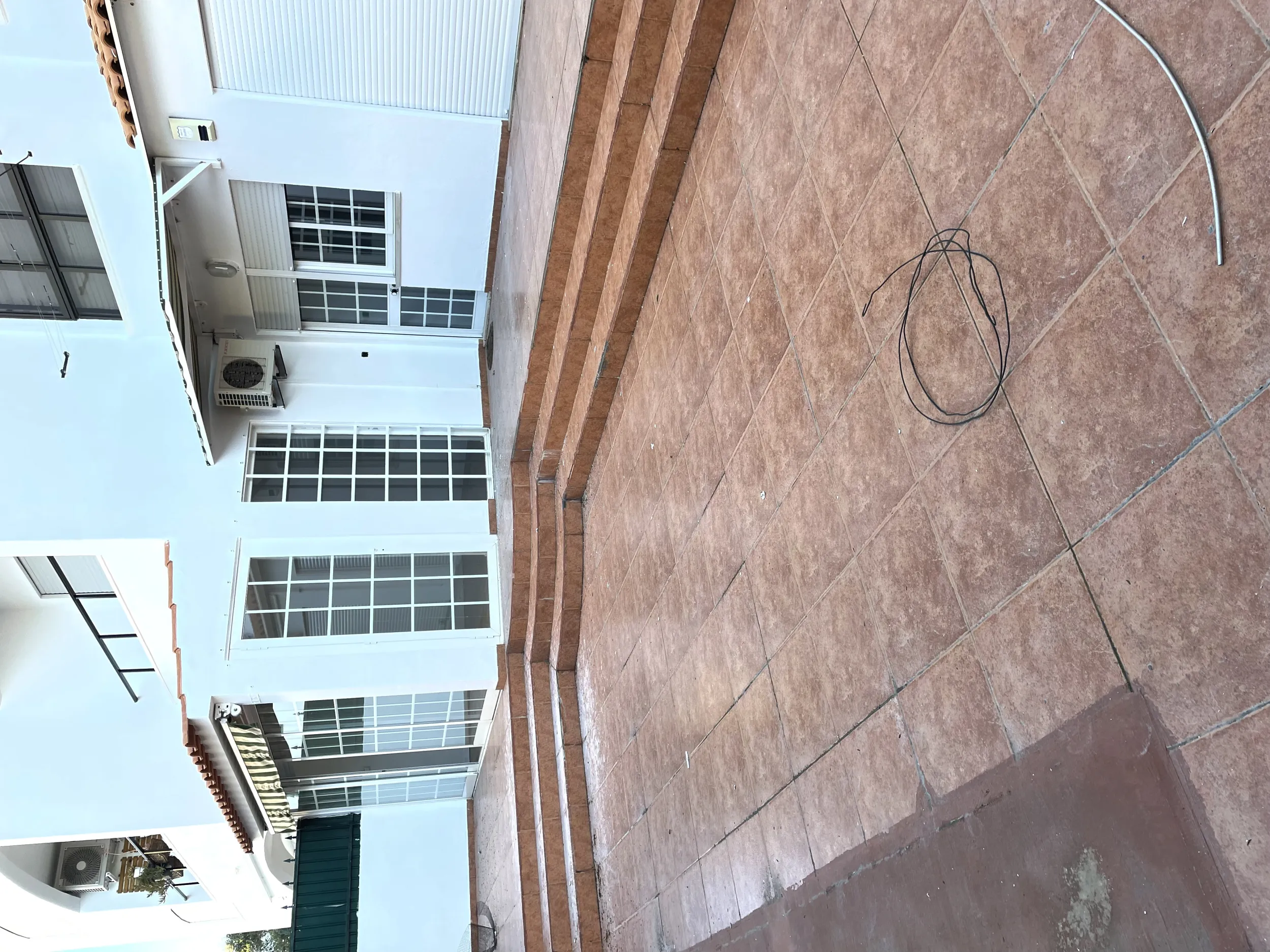 Rosa before &mdash; original balcony, narrow footprint and the trip-step down from the apartment