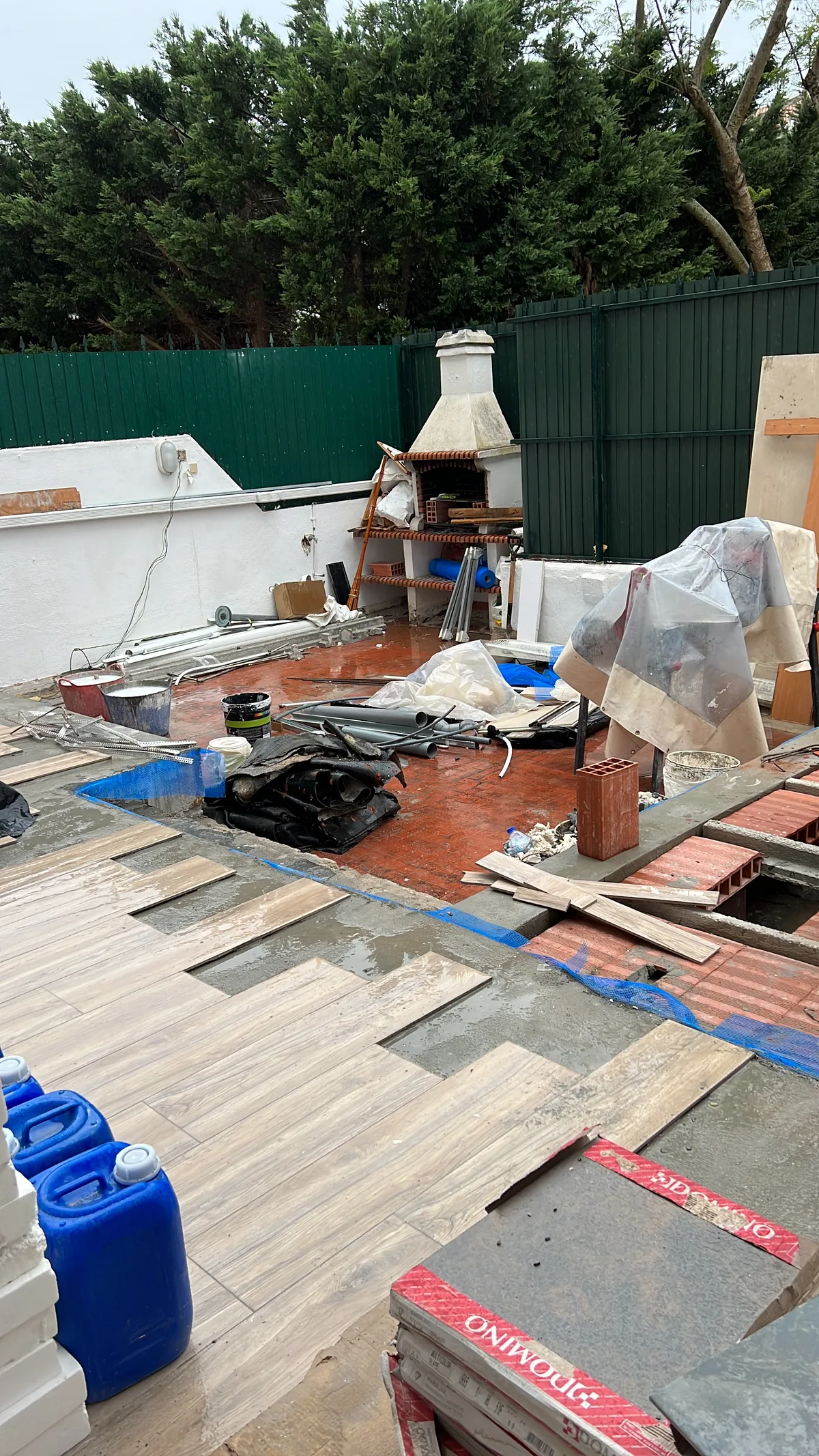 Rosa during &mdash; wood-effect tiles being laid over the rebuilt terrace