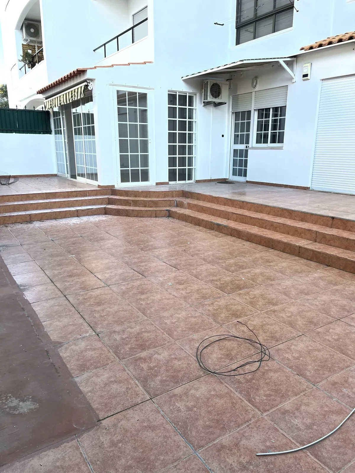 Rosa before &mdash; original balcony, narrow footprint and the trip-step down from the apartment