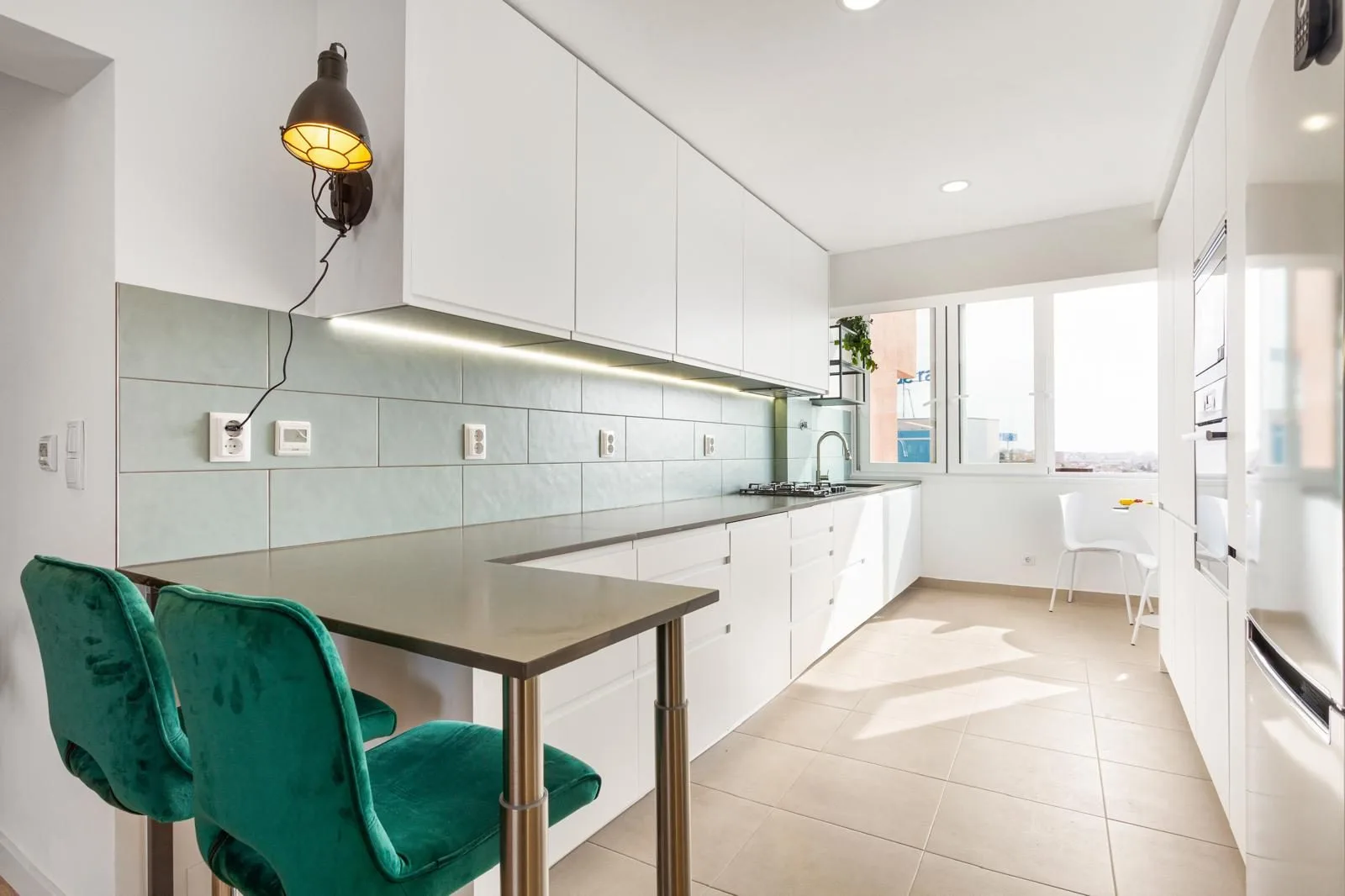 Breakfast bar with leather stools — renovated kitchen Rebelva Carcavelos by Maya's Homes