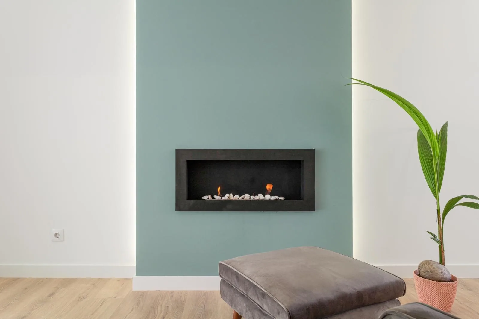 Teal-painted fireplace surround in renovated living room — Rebelva apartment Carcavelos by Maya's Homes