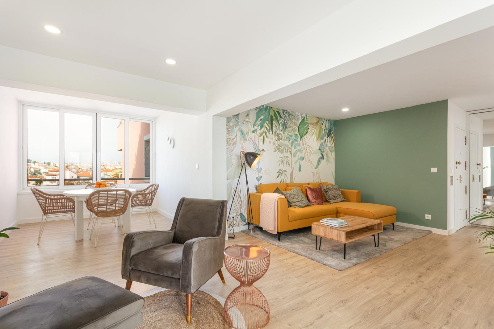 Living room wide view with wallpaper and sofa