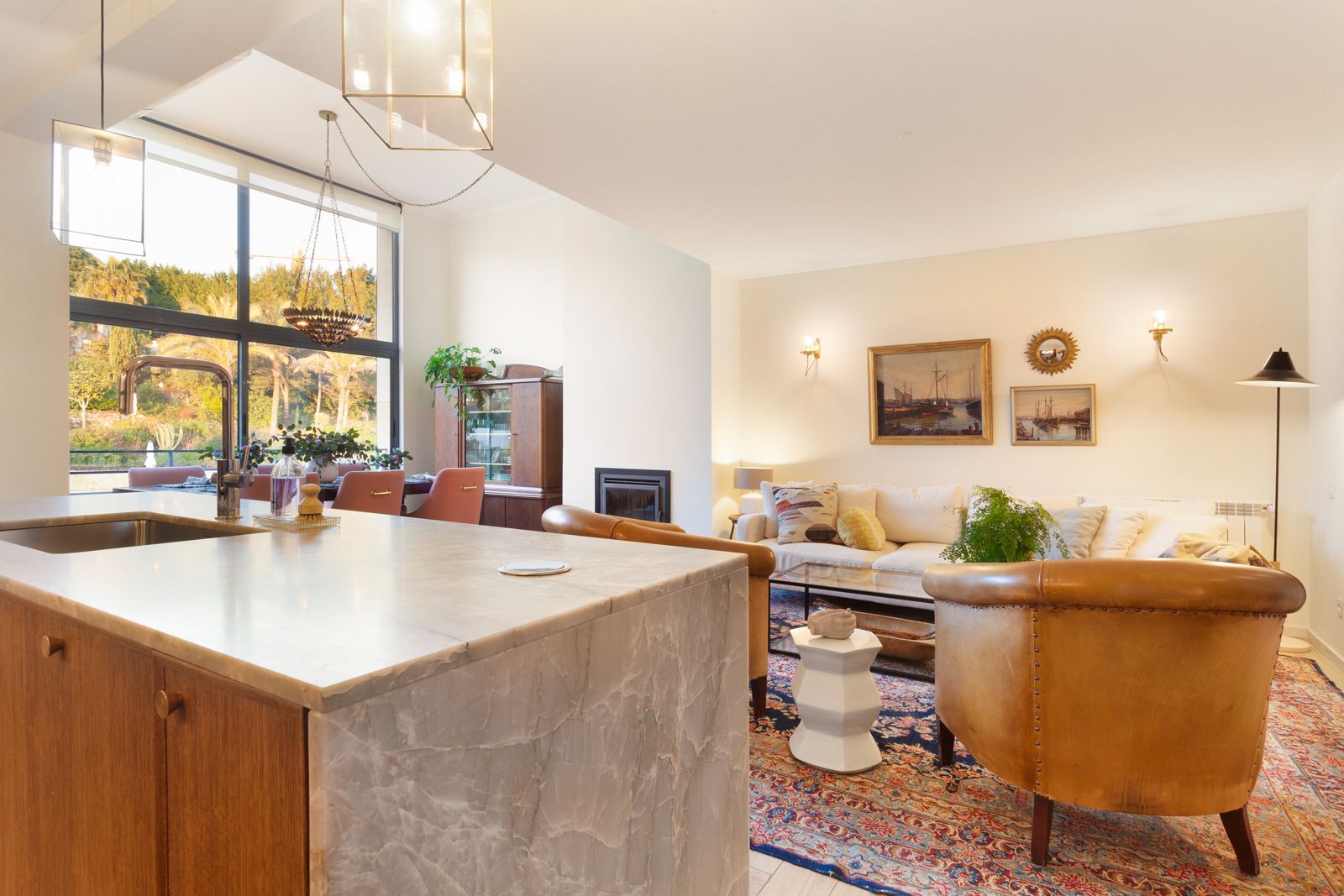 Den with green accent wall — Riviera