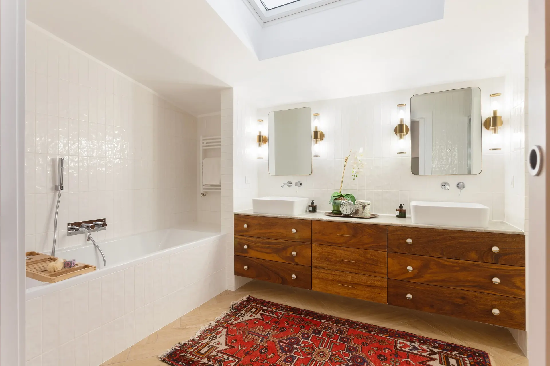 Freestanding bathtub under skylight in master bathroom — Riviera villa renovation Cascais by Maya's Homes