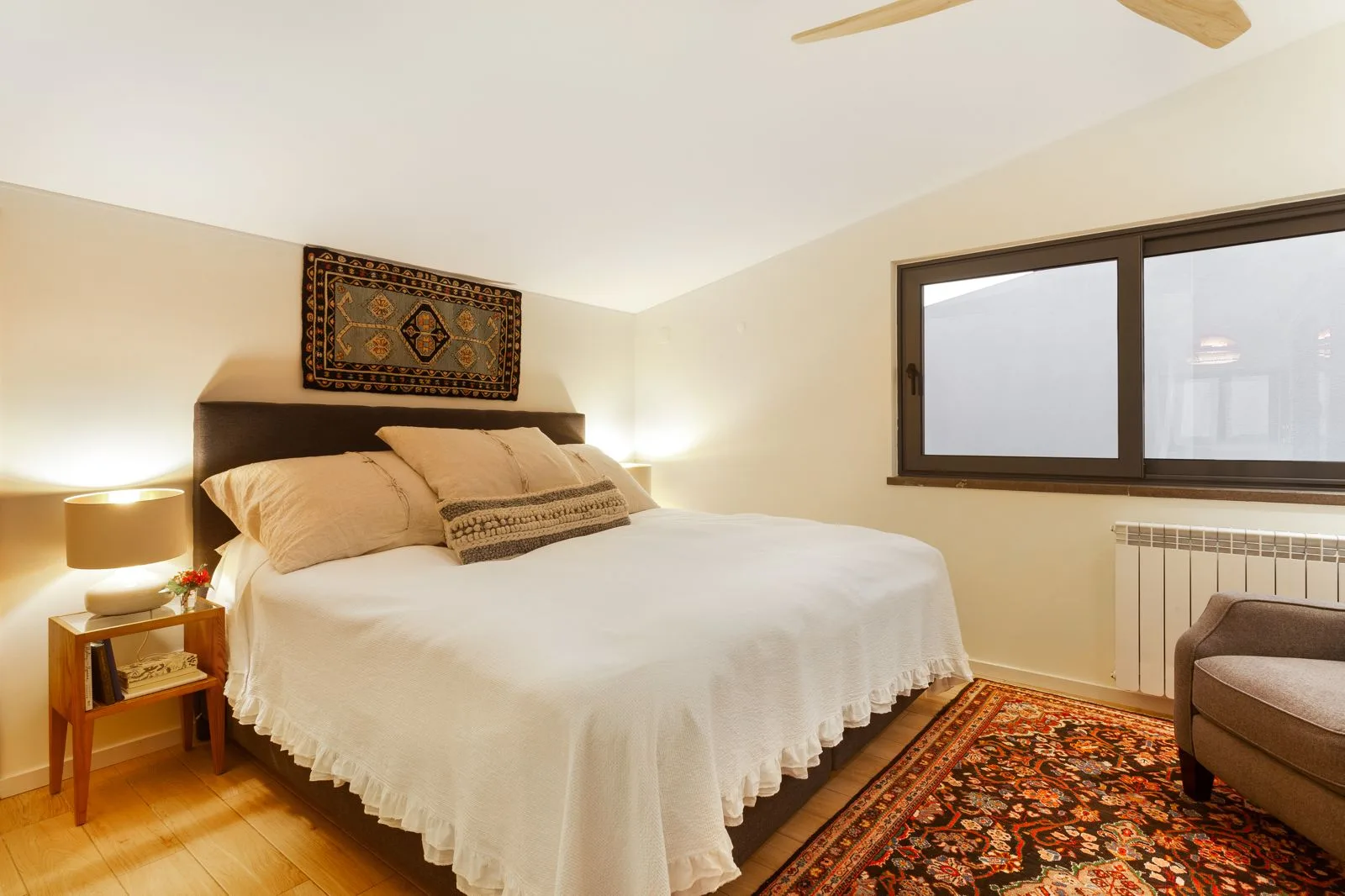 Guest bedroom with neutral tones and linen bedding — Riviera villa renovation Cascais by Maya's Homes