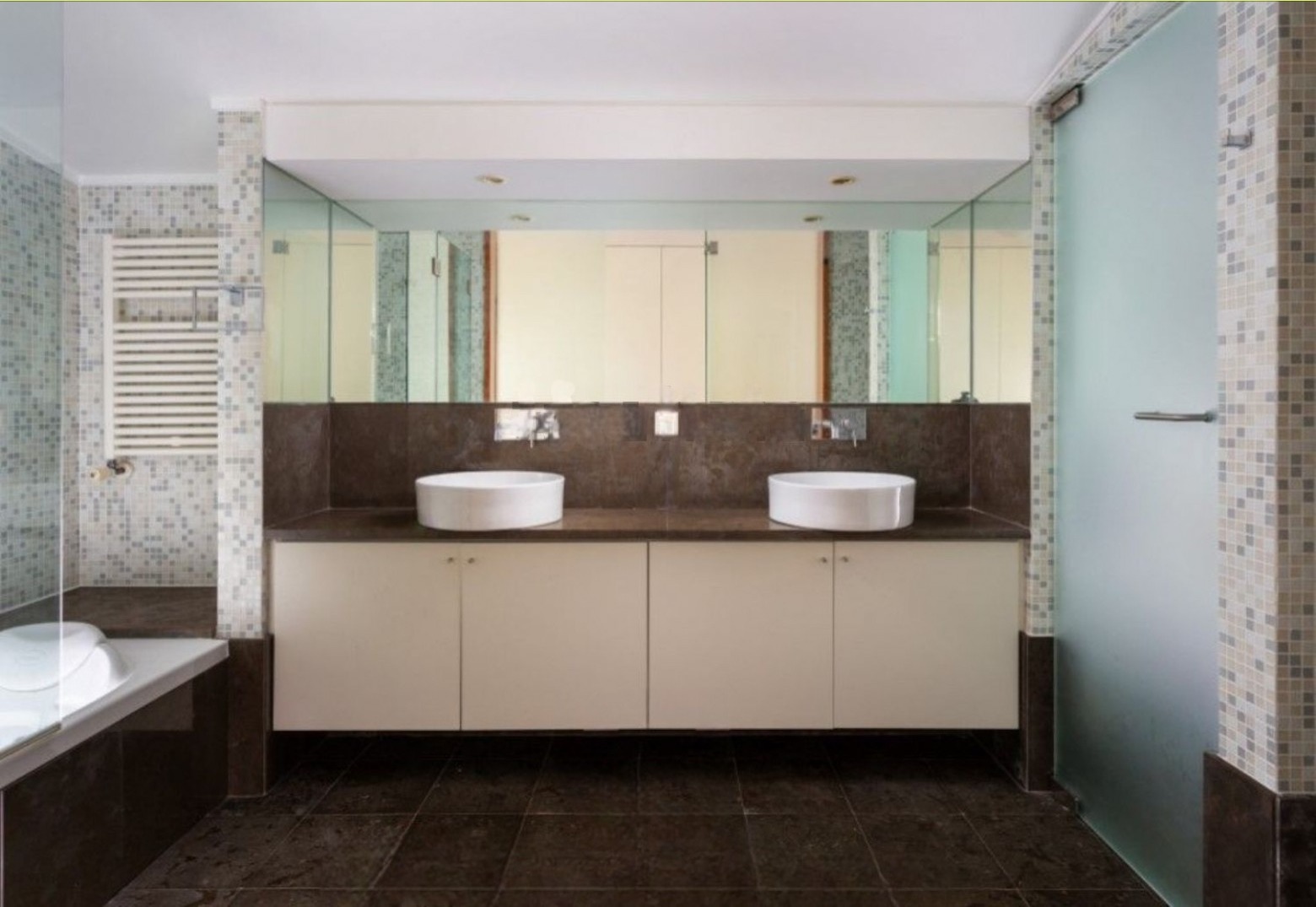 Before — master bathroom with dual sinks