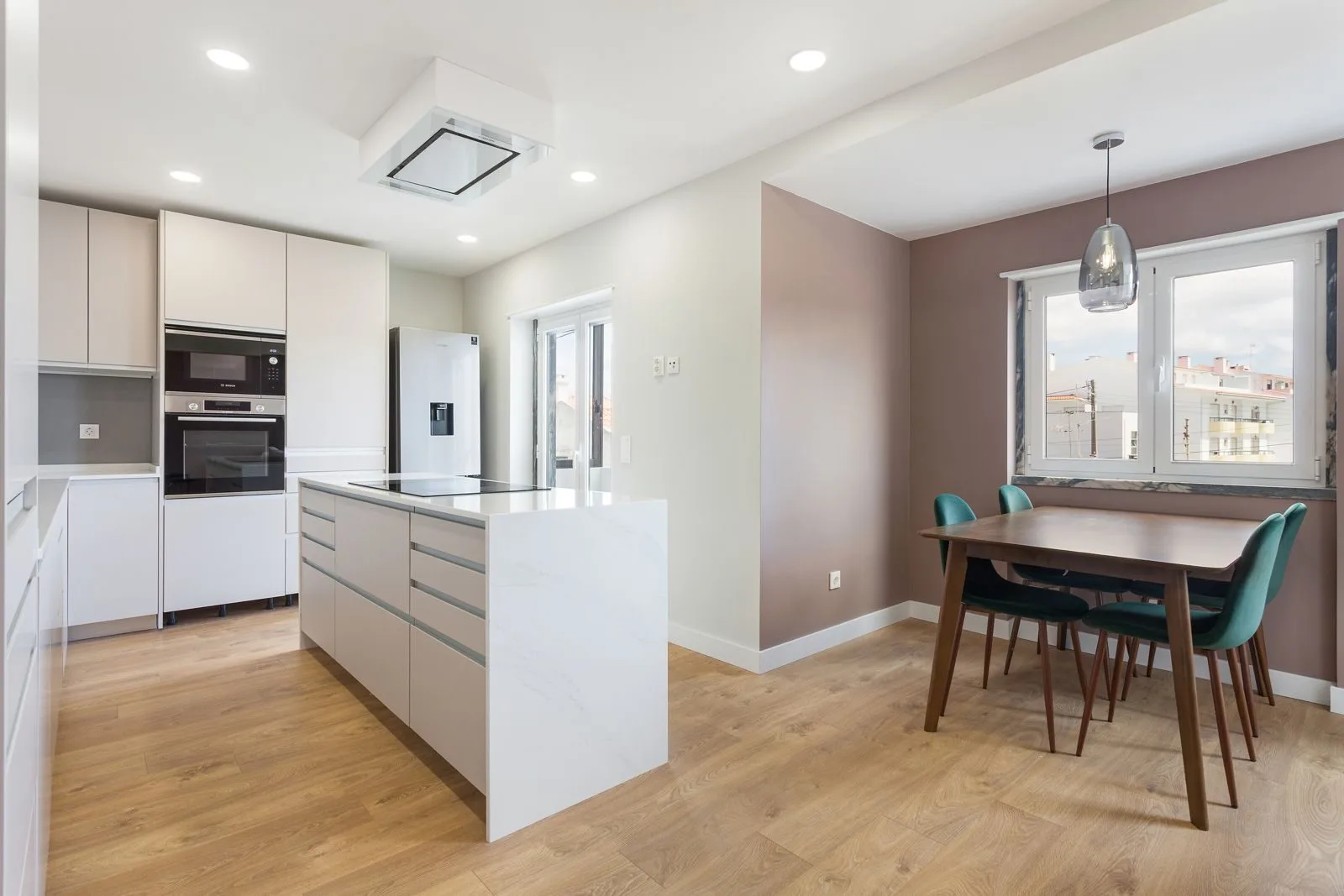 Kitchen with quartz island — Figueiras renovation by Maya's Homes