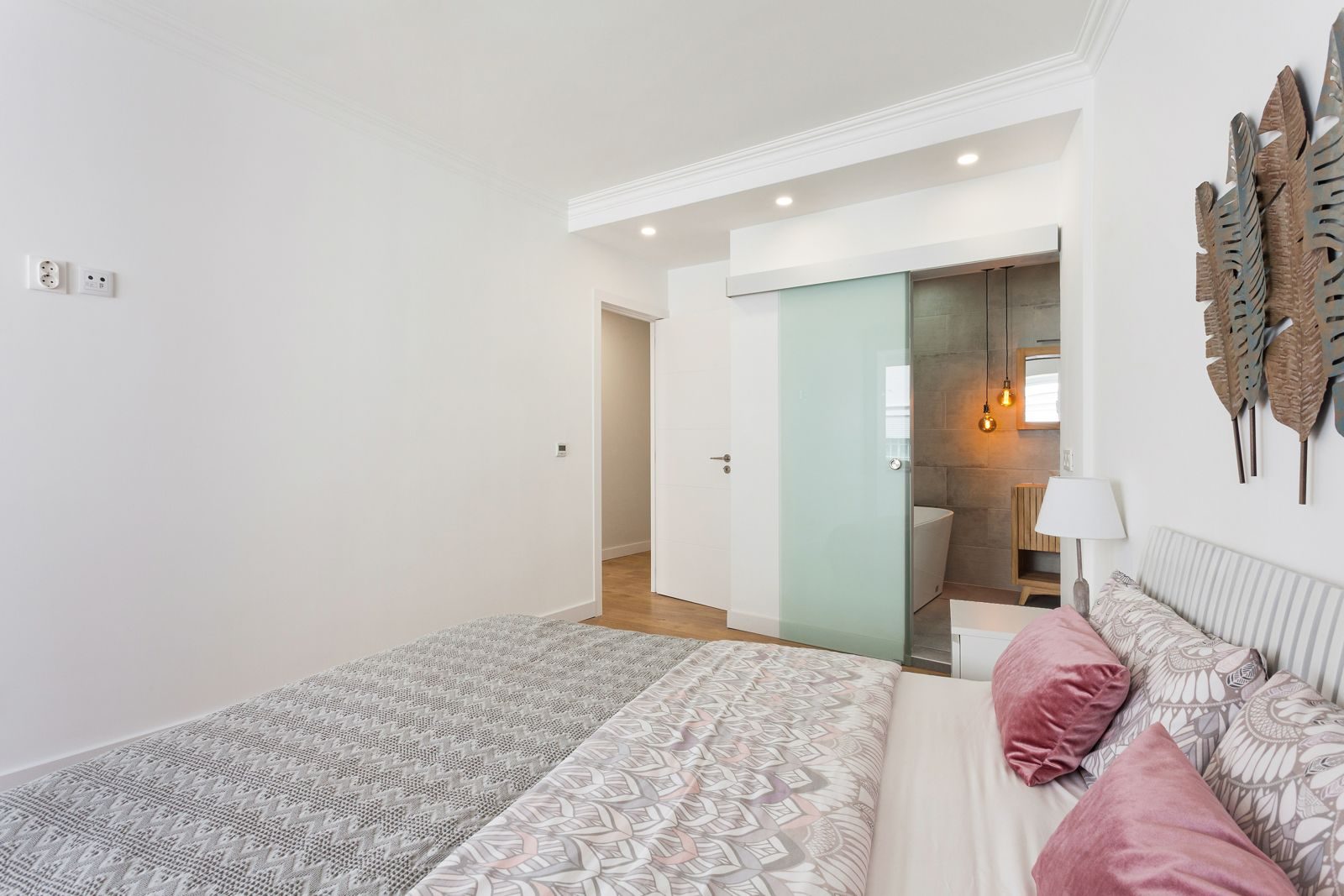 Master bedroom with mirrored wardrobe